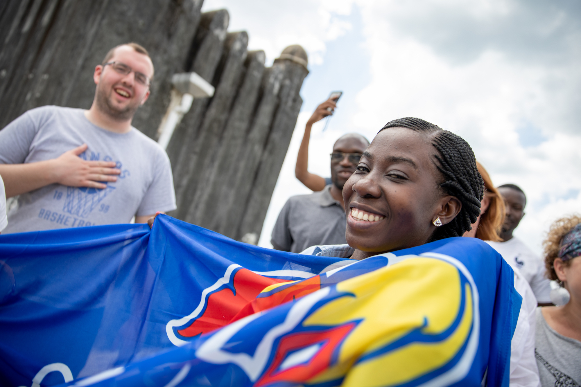 ColLAB participants taking pictures with the KU Flag