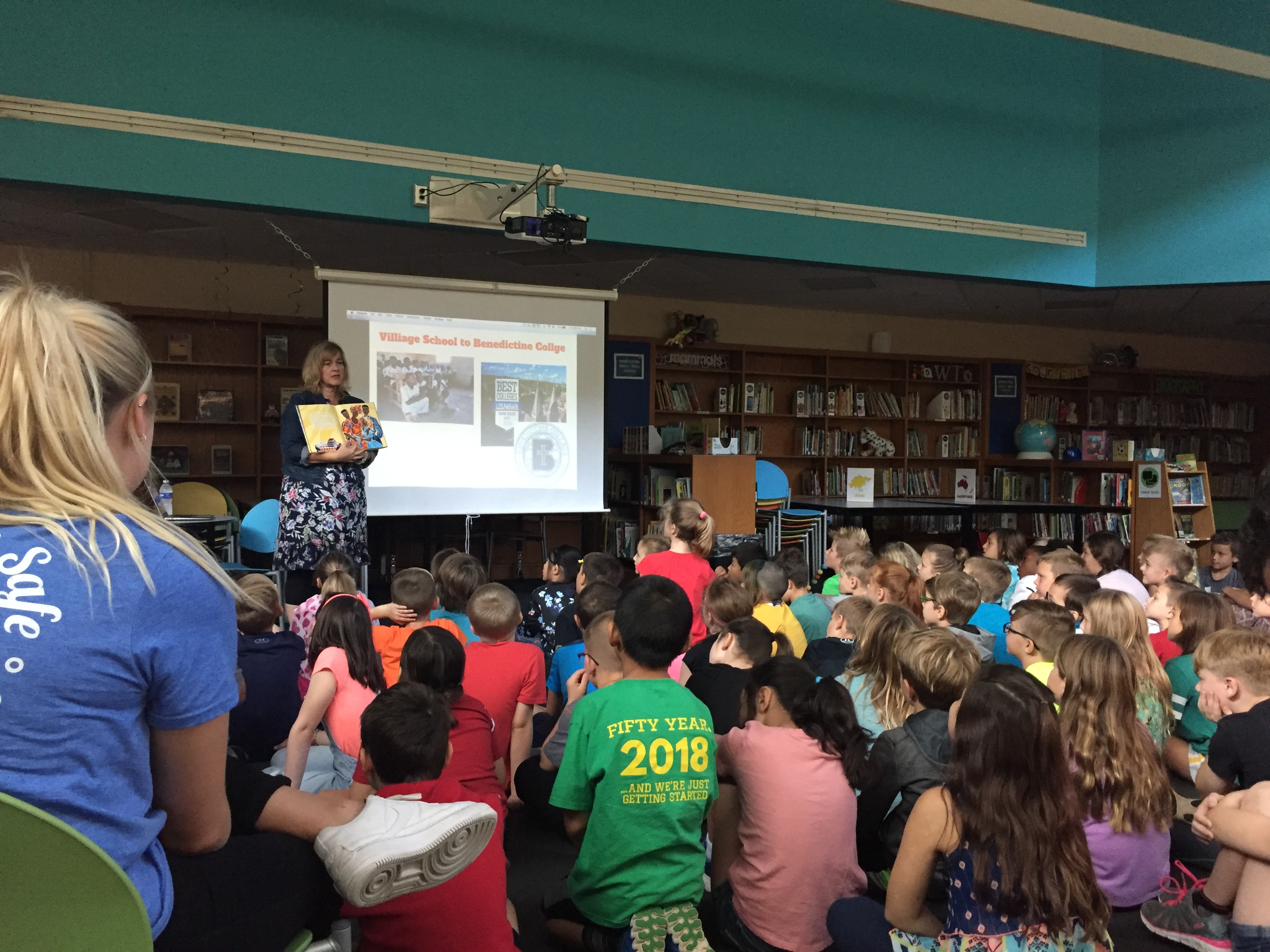 Kids watching a presentation hosted by KASC