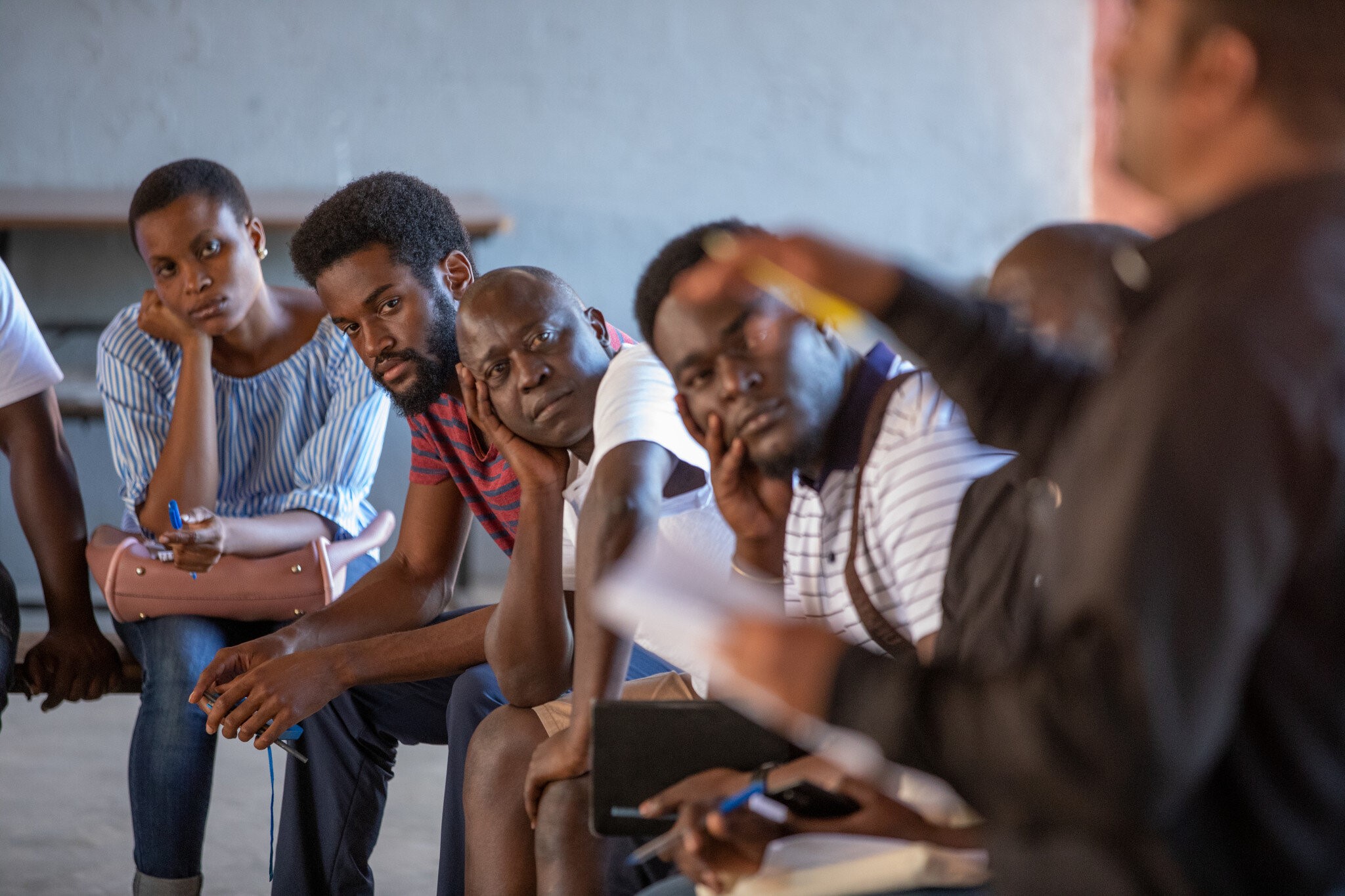 A group of men paying attention to a speaker